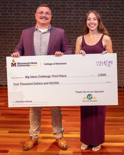 Bryce Stalboerger and Janessa Hoeschen posing with their Big Ideas Challenge award