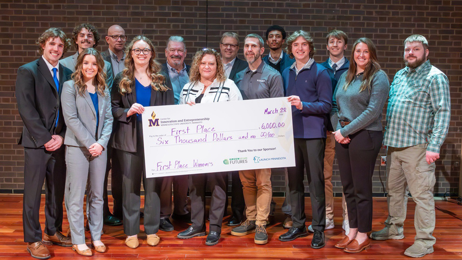 Minnesota State University, Mankato Innovation and Entrepreneurship student winners posing for a group photo with a giant check at the 2025 FutureSolvers Cultivation Challenge for first place