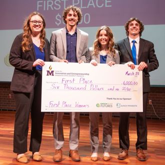 Minnesota State University, Mankato Minnesota Farm and Flavor student winners posing for a group photo with a giant check at the 2025 FutureSolvers Cultivation Challenge for first place Business Track