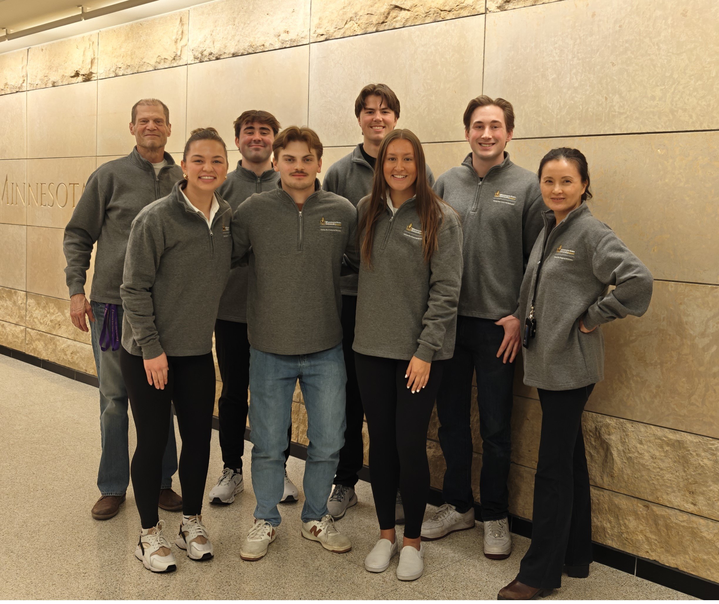 a group of people posing for a photo