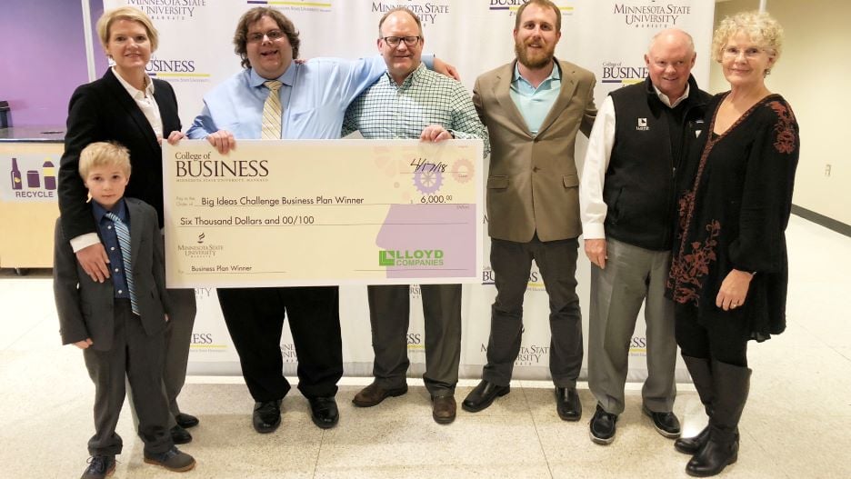 The 2018 Big Ideas Challenge winners, EnduraMark L.L.C., posing with the giant check they won from the College of Business