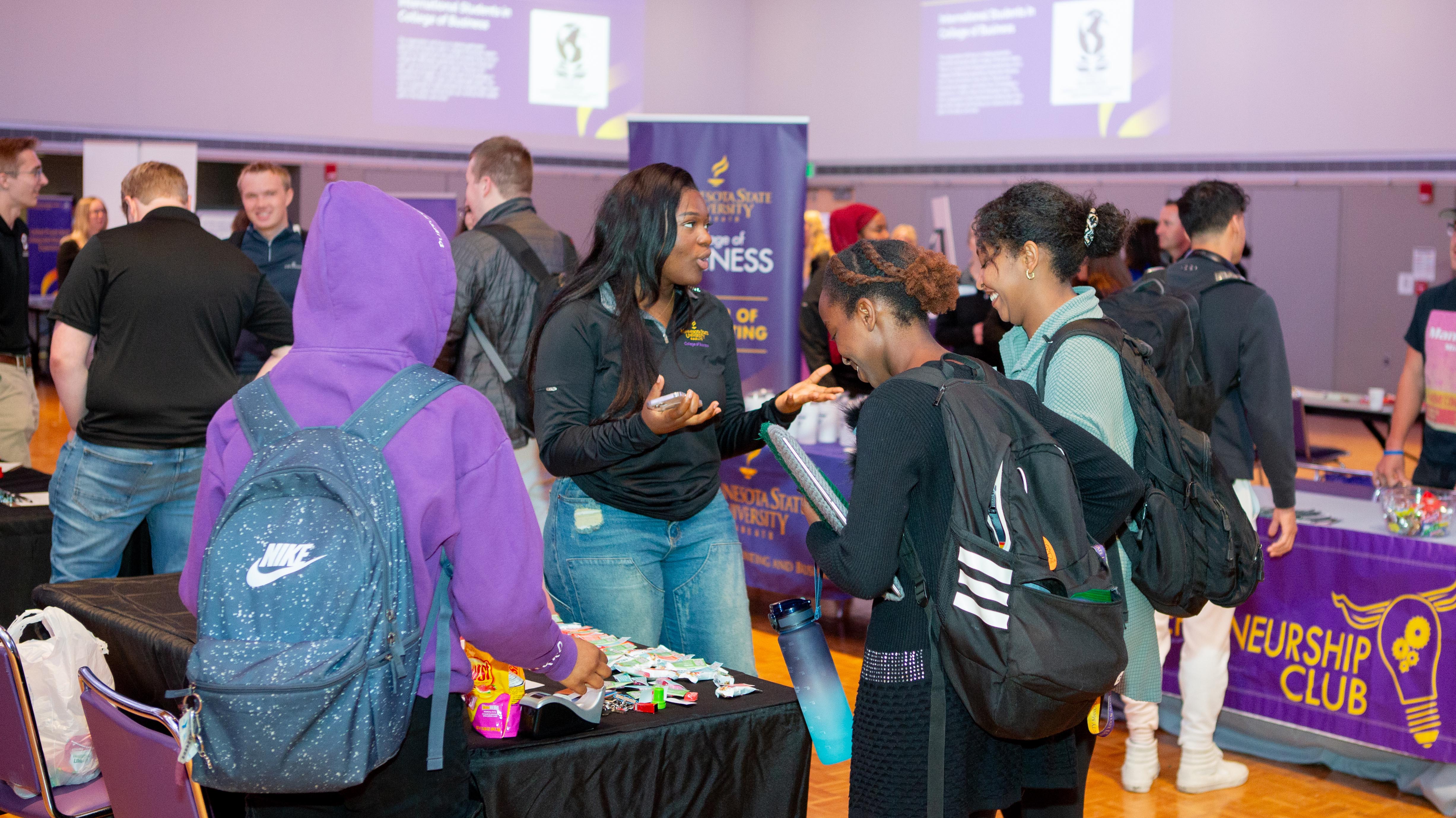 image of students engaging at the fair