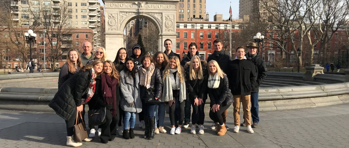 College of Business students in Washington Square Park Arch while on study tour
