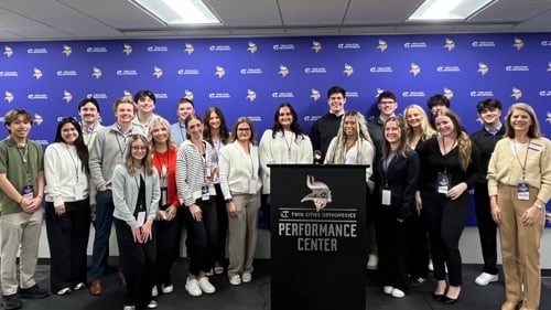 Professional Sales Organization members posing at the Twin Cities Orthopedics Performance Center
