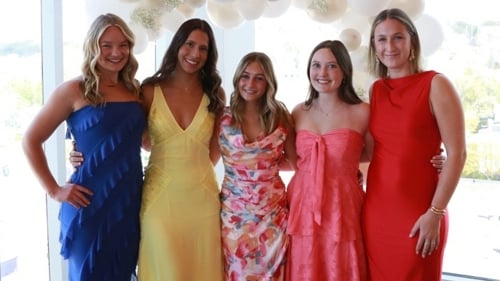 The 2026 Women in Business members posing for a group photo at an event